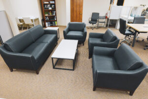 Contemporary black reception seating and coffee table in a commercial office furniture showroom in Kansas City